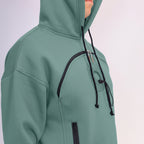 Emerald Green hoodie with black zippers on a light gray background