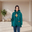 Person wearing a teal  Forest Green hoodie with a cat design on a white background