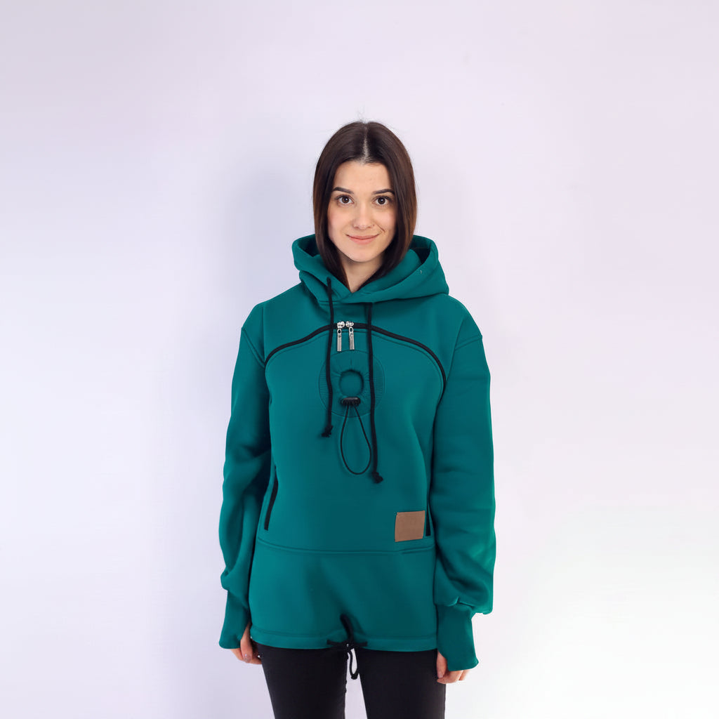 Person wearing a teal hoodie with a white background