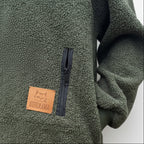 Khaki fleece jacket with a leather patch and zipper, featuring the brand 'Kotozhama'.