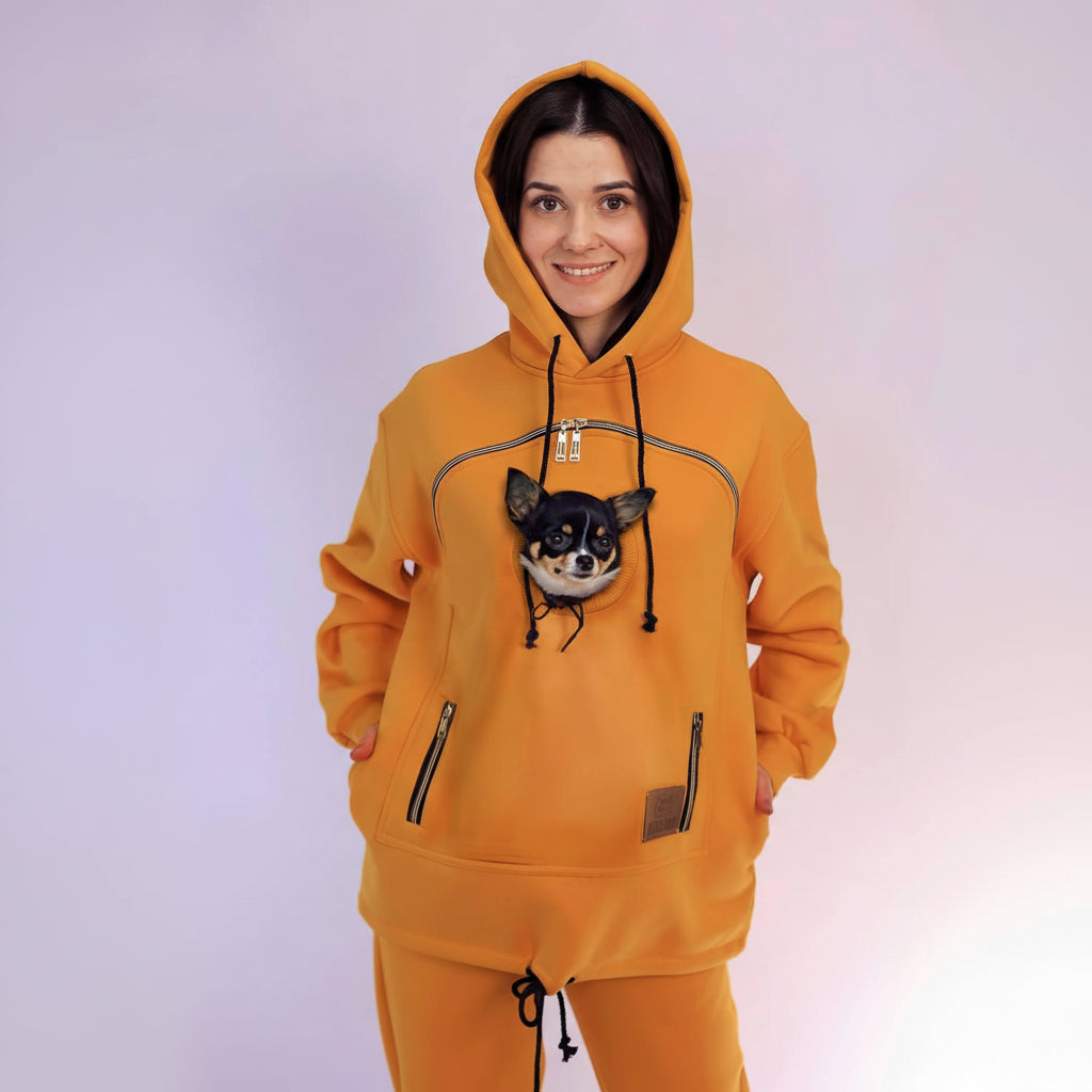 Person wearing an Mustard hoodie with a dog on a white background Main image