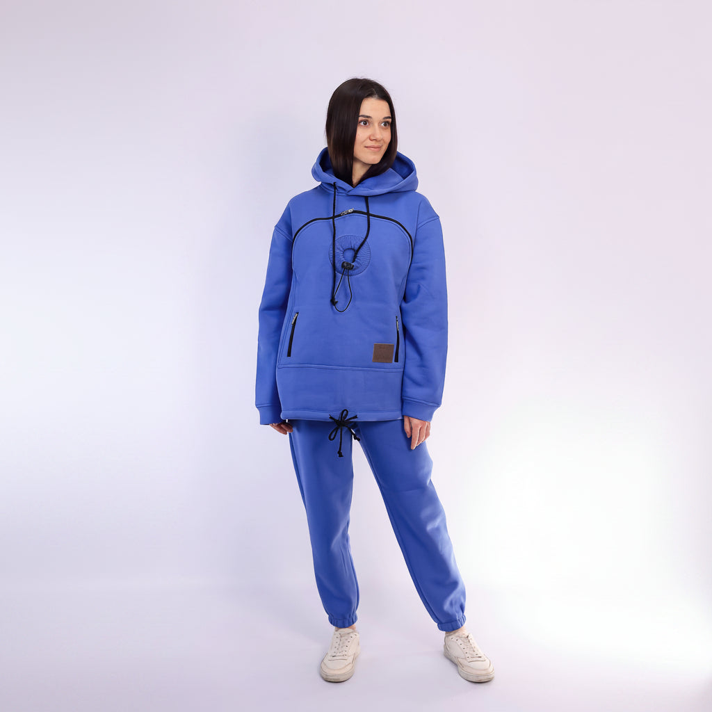 Person wearing a Royal Blue tracksuit on a white background