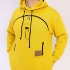 Yellow hoodie with black zippers and drawstrings on a white background
