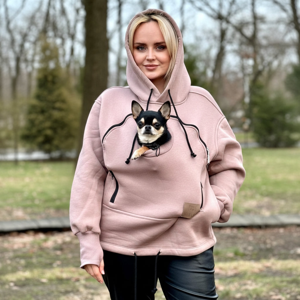 Person wearing a beige hoodie with a dog graphic outdoors Main image