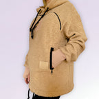 beige boucle fleece jacket with black drawstrings on a white background
