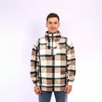 Man wearing a plaid shirt with a white background