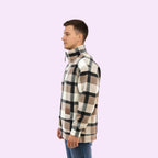 Man wearing a plaid shirt with a white background