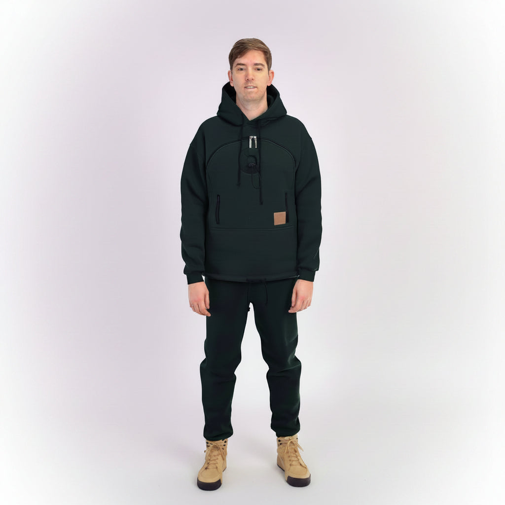 Person wearing a black hoodie and pants on a white background