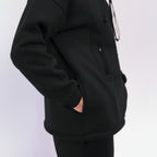 Person wearing a black hoodie 