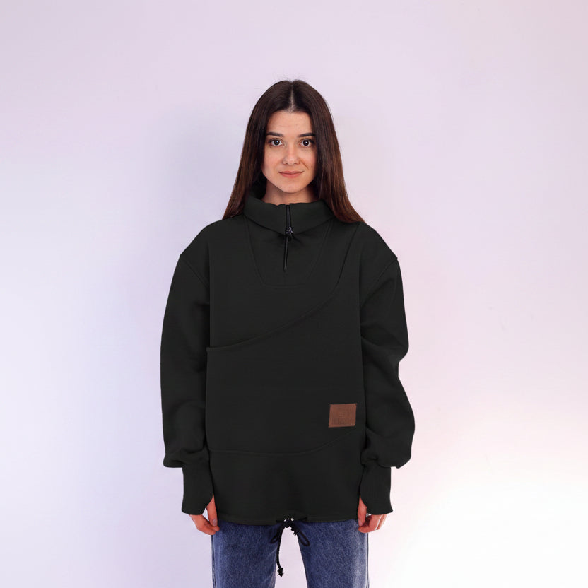 Person wearing a black sweatshirt with a brown patch on a white background
