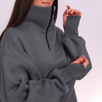 Gray sweatshirt with a high collar and long sleeves on a white background