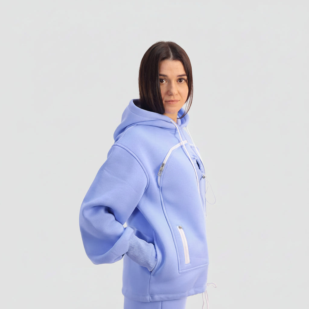 Person wearing a light blue hoodie with a white background