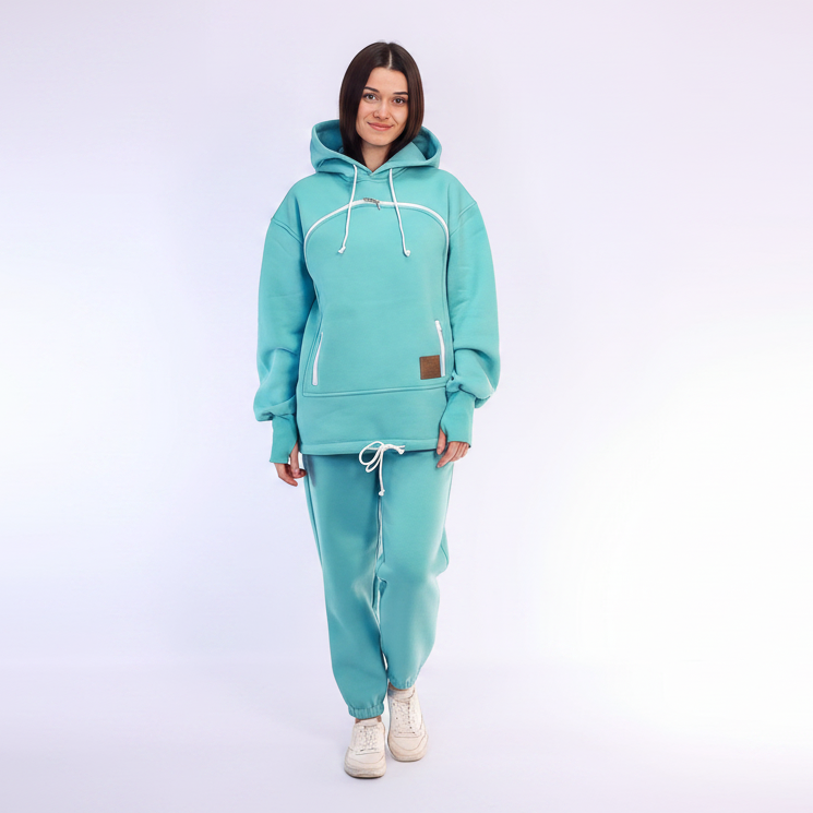 Women wearing a mint tracksuit on a white background
