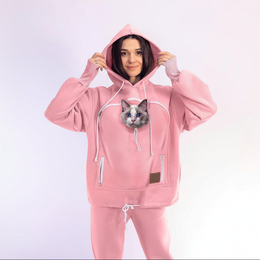 Person wearing a pink Set with a cat on a white background