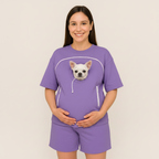 Person wearing a purple outfit with a dog graphic on a plain background