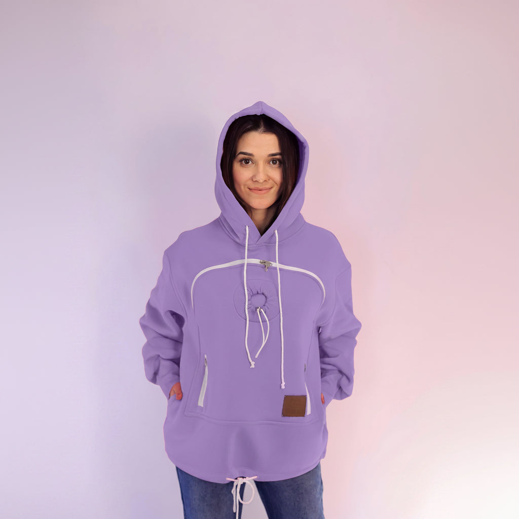 Person wearing a purple hoodie with a plain background