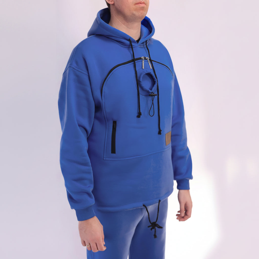 Person wearing a royal blue hoodie with black drawstrings on a white background