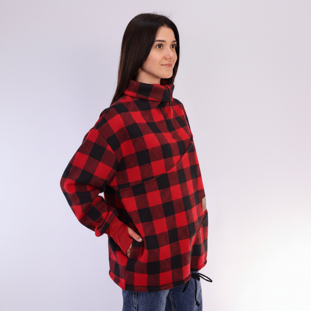 Women wearing a red square plaid sweatshirt on white background