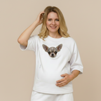Woman wearing a white t-shirt with a dog on a beige background